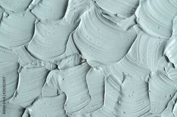 Obraz Gray cosmetic clay (facial bentonite mask, cream, scrub, body wrap) texture close up. Abstract background with brush strokes.