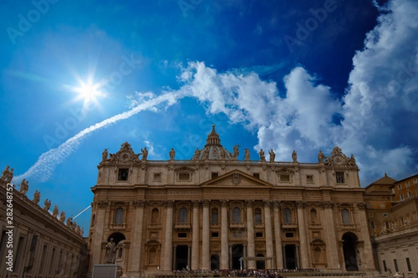 Obraz St. Peter's Basilica during the day with a beautiful blue sky in the Vatican