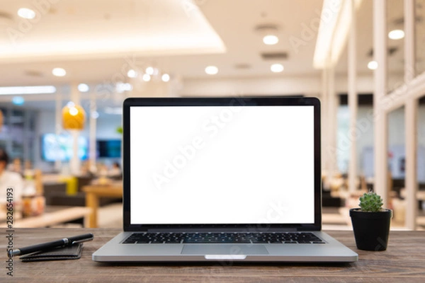 Fototapeta Desk Laptop with blank screen on table
