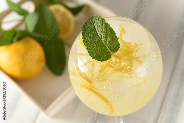 Fototapeta cold refreshing drink with lemon and mint
