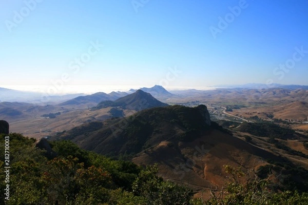 Fototapeta Nine Sisters or the Morros San Luis Obispo Bishops Peak with blue sky and view towards morro bay