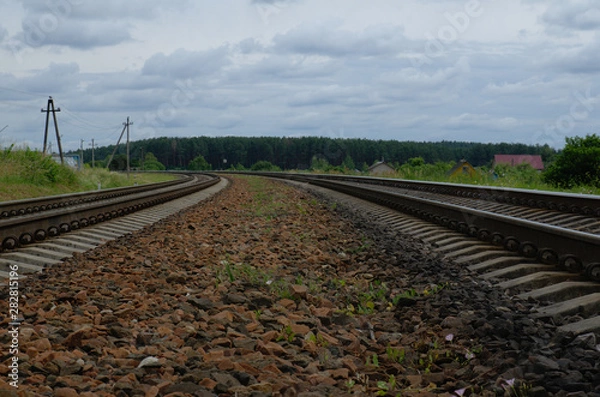 Obraz Railway stones at railroad track. Landscape with sky. Outskirts of Vitebsk, Belarus