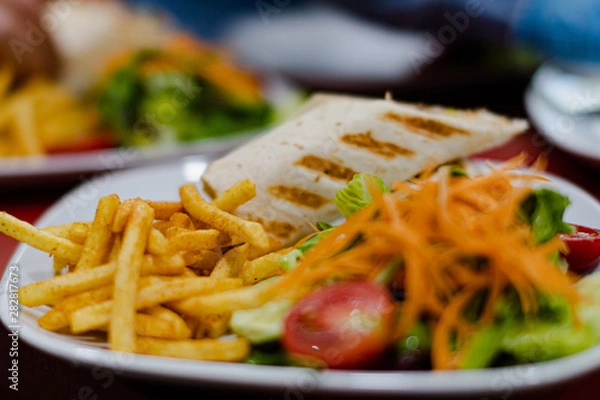 Obraz Serviced Wrap with potato and salad in plate