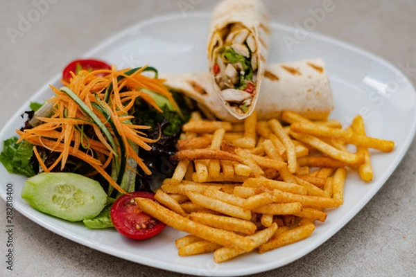 Obraz Serviced Wrap with potato and salad in plate