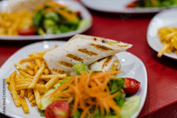Obraz Serviced Wrap with potato and salad in plate