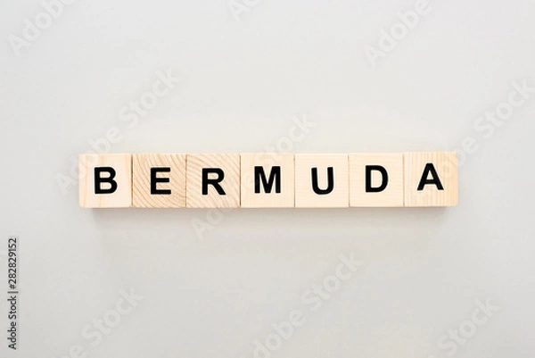 Fototapeta top view of wooden blocks with Bermuda lettering on white background