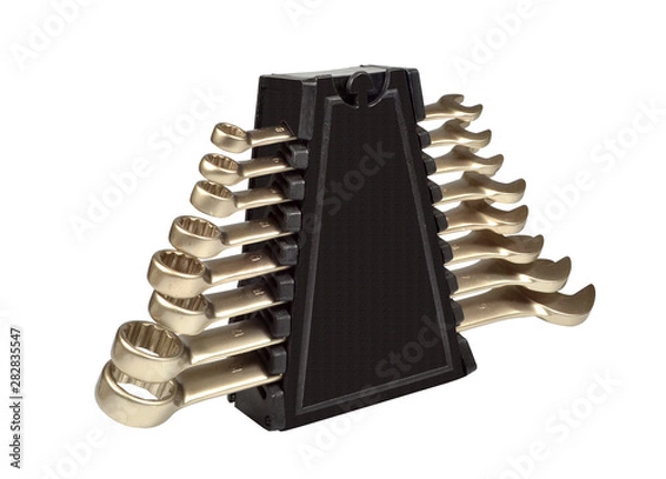 Fototapeta A set of wrenches of different diameters on a stand.  Hand tool. Isolated on white background