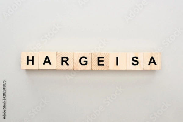 Fototapeta top view of wooden blocks with Hargeisa lettering on grey background