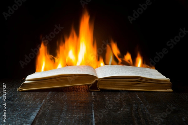 Fototapeta Open book on a background of flames
