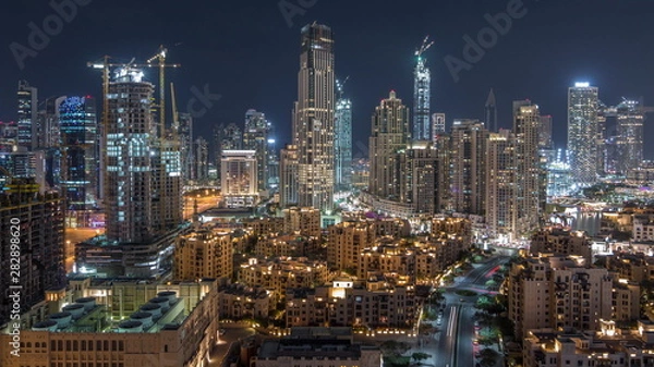 Fototapeta Beautiful skyline of Dubai downtown and Business bay with modern architecture night timelapse.