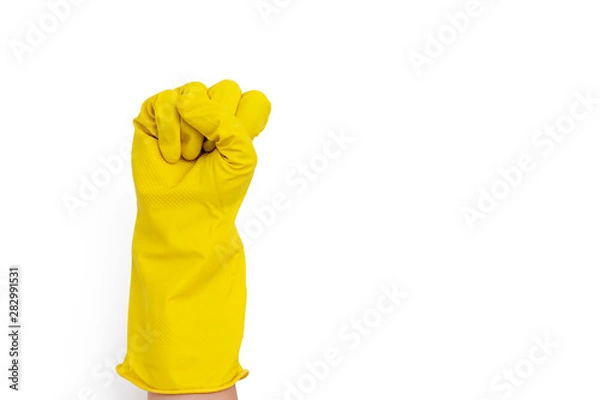 Obraz Hand in a yellow rubber glove gesturing fist isolated on white background