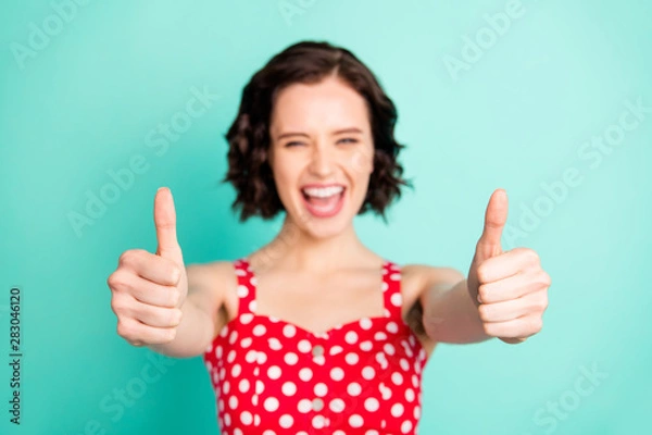 Obraz Photo of nice overjoyed enjoying girl having achieved all set aims and now only thing left for her to do is enjoying life while isolated with teal background