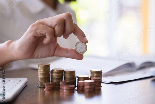 Fototapeta coins stacking, coins and money for finance and banking, saving money or interest increasing concept