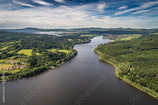 Fototapeta The Lipno Reservoir  is a dam and hydroelectric plant constructed along the Vltava River in the Czech Republic. This area is mountainous, and borders the Sumava National Park and Nature Reserve
