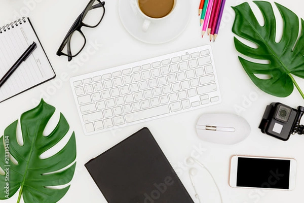 Fototapeta Creative flat lay photo of modern workplace with laptop, top view laptop background and copy space on white background, Above view shot of Computers on white background