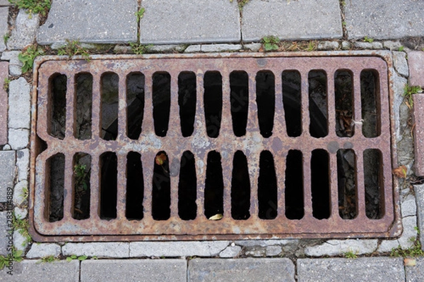 Obraz rusty old rectangular sewer grate