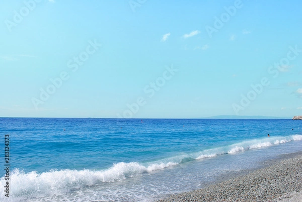 Fototapeta Pebbly beach and tropical sea. Calabria, Italy