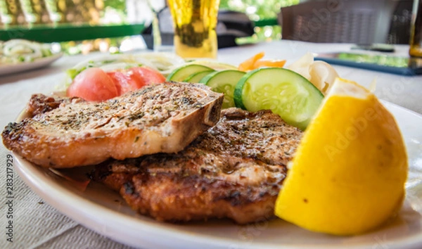 Obraz Grilled piglet meat with vegetable.