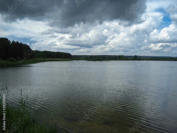 Obraz Clouds over the lake