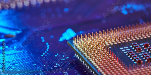 Obraz chip is highlighted with blue light. Technology background