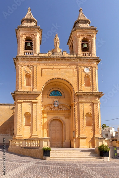 Fototapeta Marsaxlokk. The building of the church of St. Peter on a sunny morning.