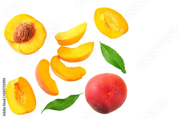 Fototapeta peach fruit with green leaf and slices isolated on white background. top view