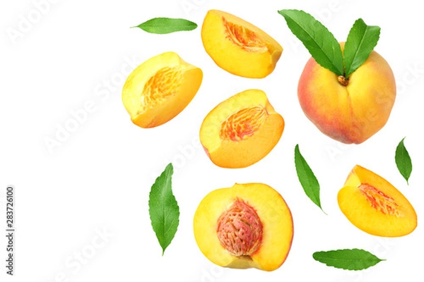 Fototapeta peach fruit with green leaf and slices isolated on white background. top view