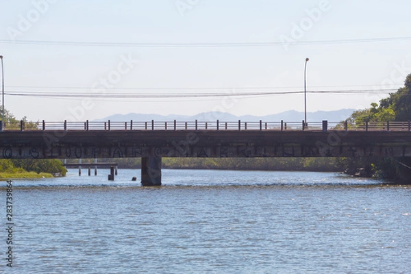 Obraz Bridge over Peruibe River in Peruibe, Brazil