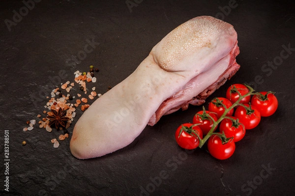 Fototapeta top view on raw pig tongue with spices and tomatoes cherry