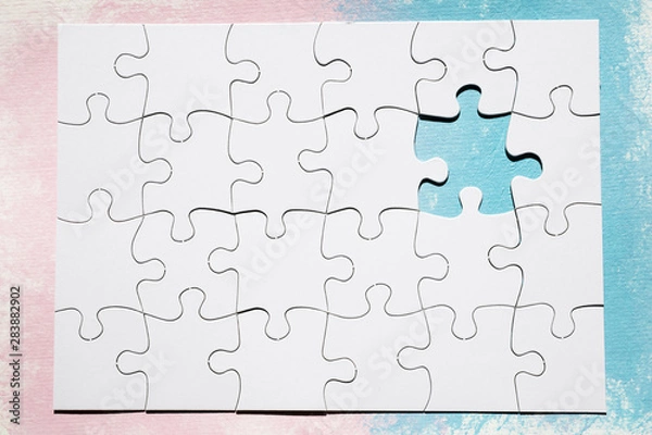 Fototapeta Missing piece of white puzzle over dual colored surface