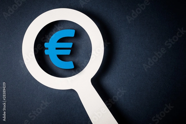 Obraz Checking finance with magnifying glass