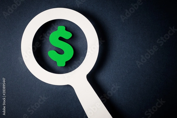 Obraz Checking finance with magnifying glass