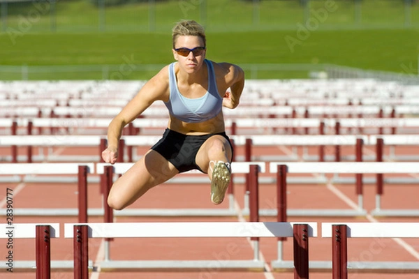 Obraz Athlete Jumping over Hurdles