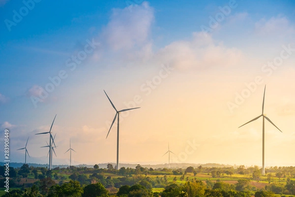 Fototapeta Green energy concept, eco power. Wind turbine located along the hill with the wind blowing all the time. Can produce renewable energy as well. Considered a clean energy.