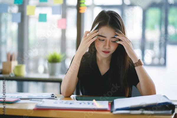 Obraz Confused business woman with stressed and worried about  working mistake and problems.