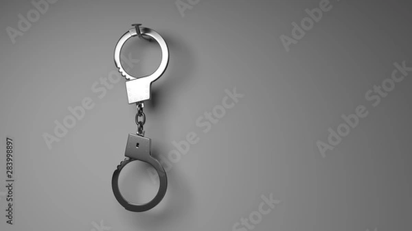 Obraz Dangling handcuffs on a nail.