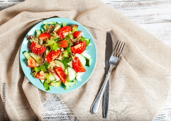 Obraz vegetable salad on a light, wooden background, the concept of a healthy diet, vegetarianism