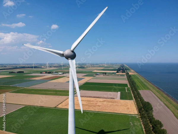 Obraz Drone photo of a large windmill with a total height of 198 meters with a shaft height of 135 meters. In the background, the wieringermeer polder..Photo taken at an altitude of 160 meters