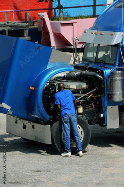 Fototapeta Diesel Mechanic at Work