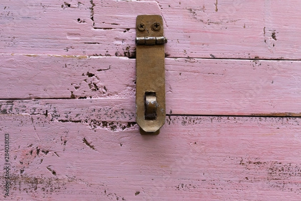 Obraz Background in the form of an iron canopy for a lock on an old pink wooden chest