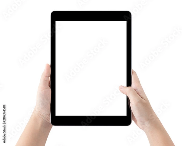 Fototapeta Ręce, trzymając komputer typu tablet i pusty biały ekran na stole ze ścieżką przycinającą.