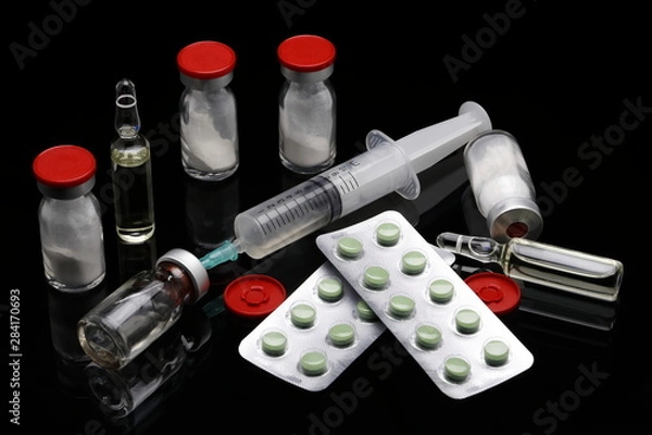 Fototapeta cortisone treatment, syringe and cortisone bottles