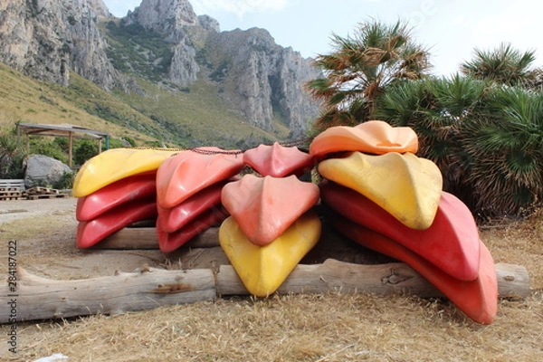 Fototapeta Colorful kayaks on beach