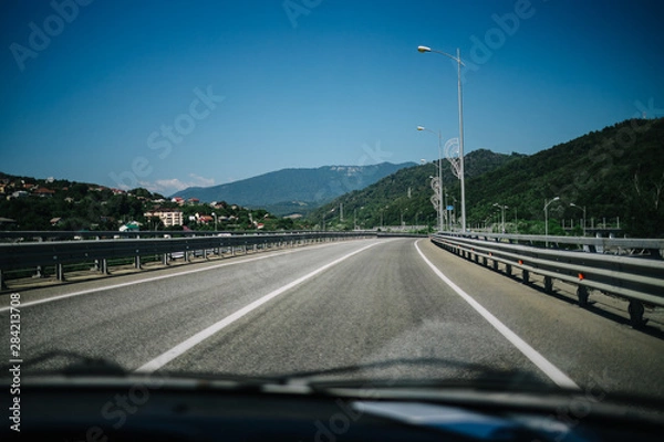 Fototapeta on the way to the mountains the road