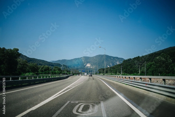 Fototapeta on the way to the mountains the road