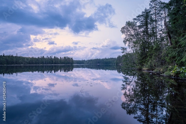 Obraz Scenic summer night landscape with mood light and beautiful reflections at lakeside in Finland.