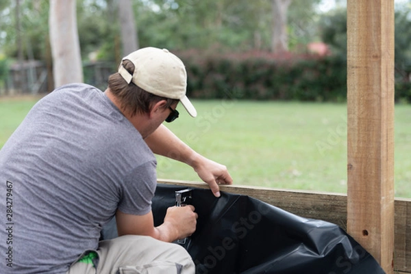 Obraz Handy man using staple gun
