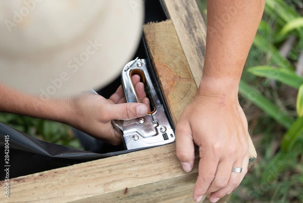 Obraz Handy man using staple gun