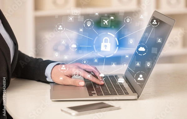 Fototapeta Business woman below chest working on laptop in a cozy homey environment with secured connection concept