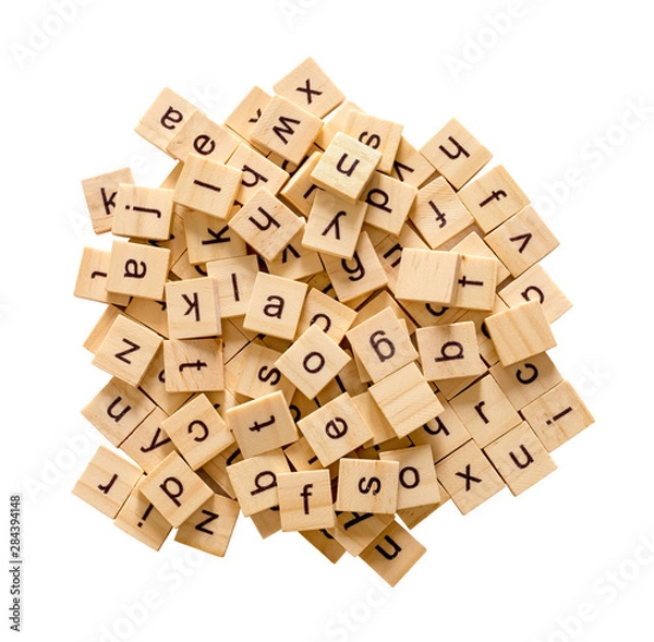 Fototapeta Pile of alphabet letters on wooden scrabble pieces, isolated on white background with clipping path.